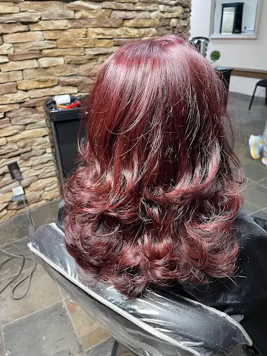 Burgundy hair with curled ends